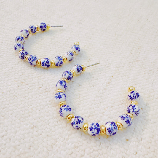 Blue Bloom Floral Hoop Earrings – Elegant Hoops with Soft Blue Flower