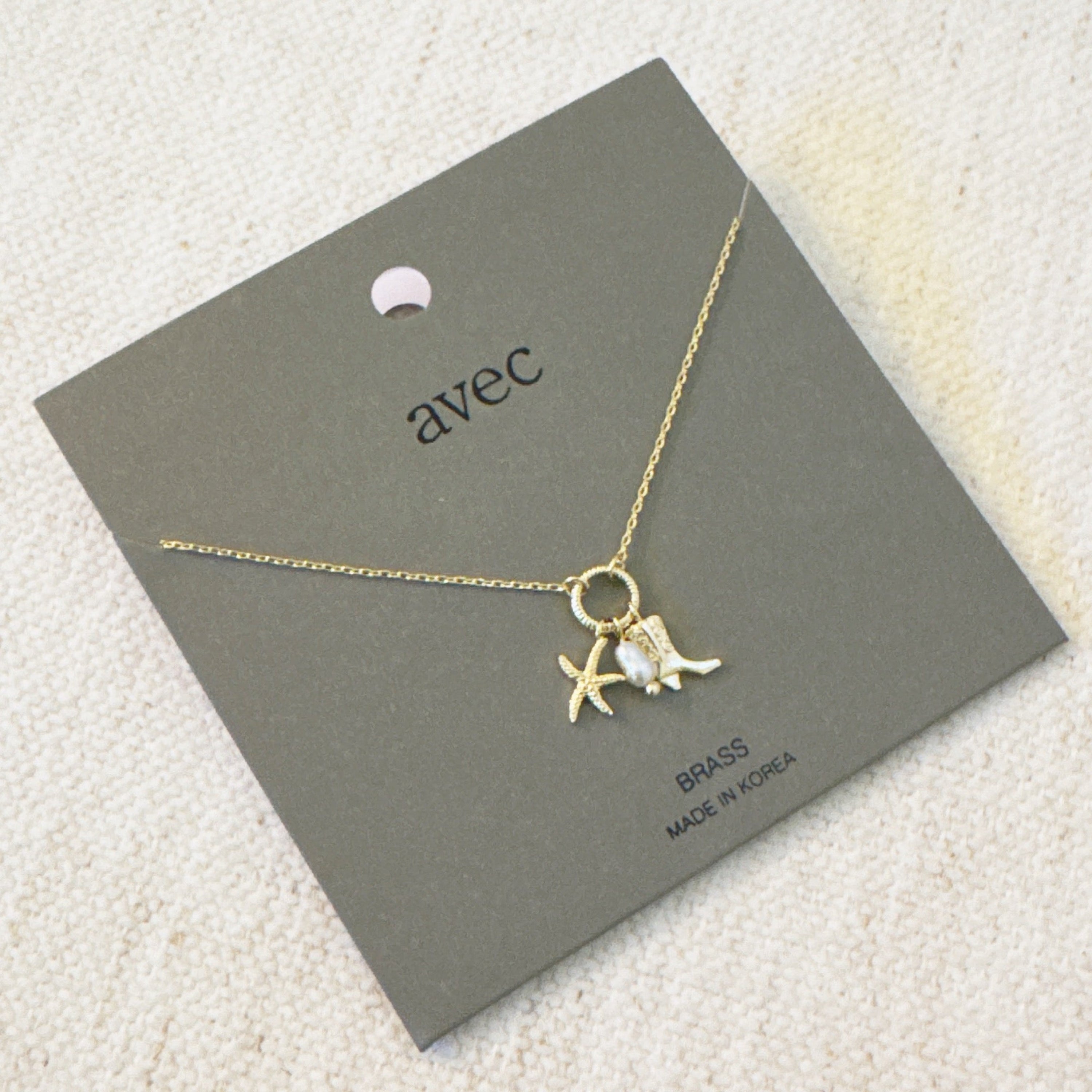 Coastal Cowgirl Necklace – Gold-Tone Chain with Starfish and Western